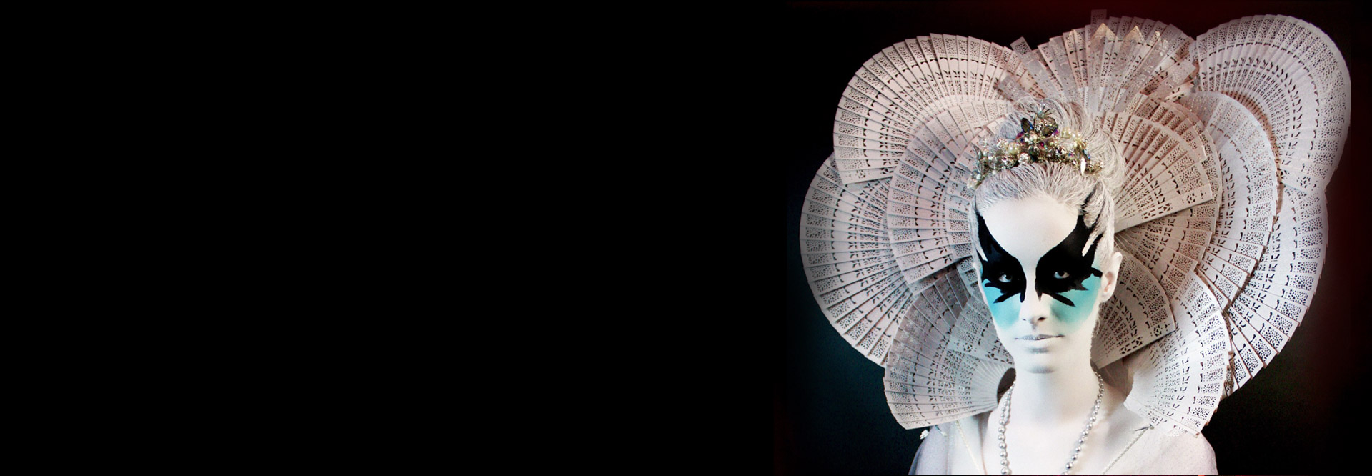 woman with white face and doilies behind her