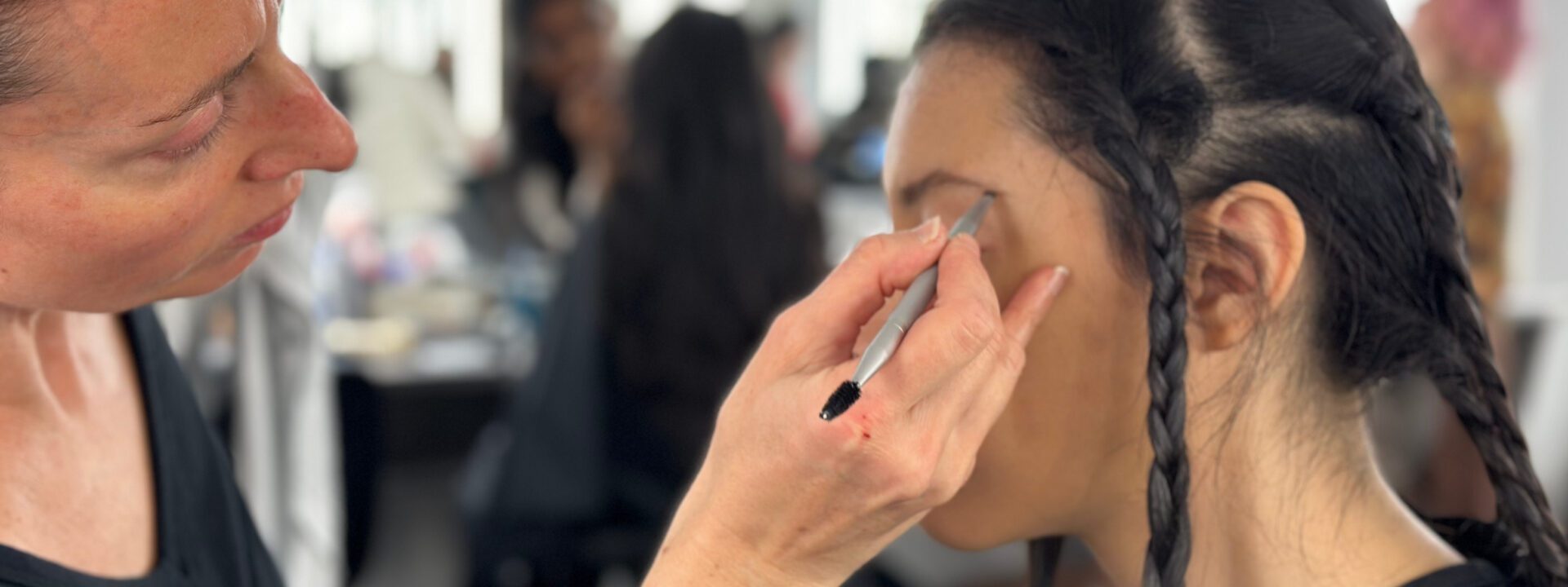 Liz Robertson prepping the model for a bridal shoot